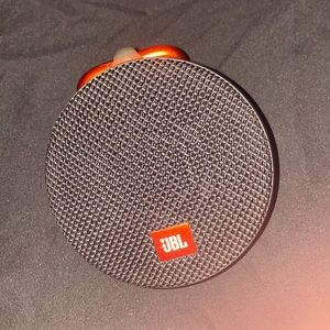 JBL clip speaker its loud and portable, bluetooth , you can talk on the phone to